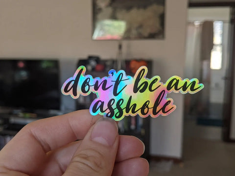 Don't be an asshole cursive vinyl sticker: Holographic