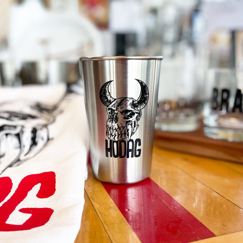 stainless steel pint with hodag skull print and word 'hodag' underneath 