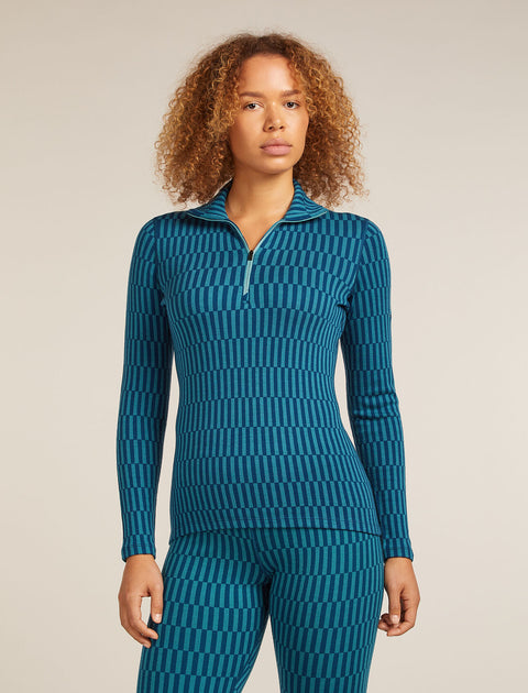 Woman wearing a blue patterned outfit on a beige background