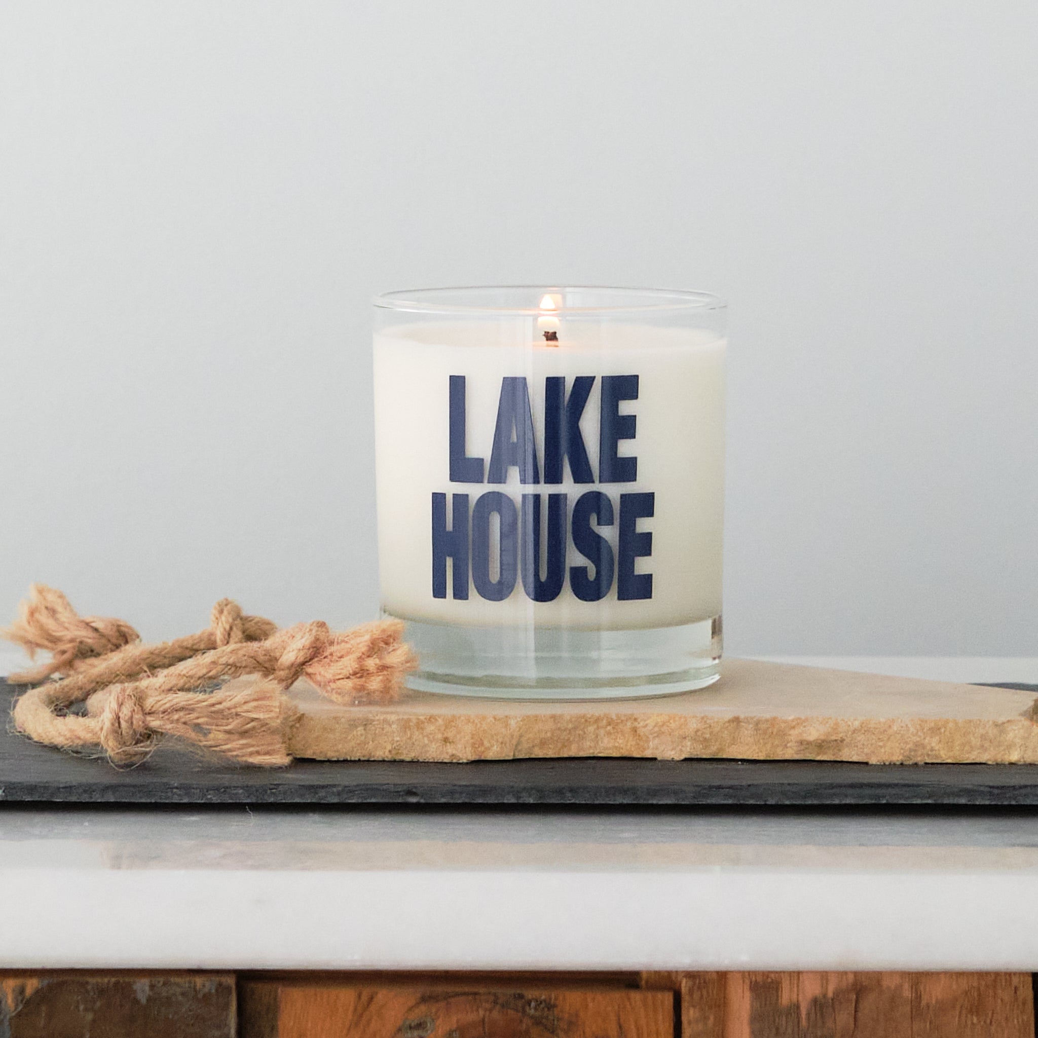container soy candle with Lake House printed in navy ink on the front