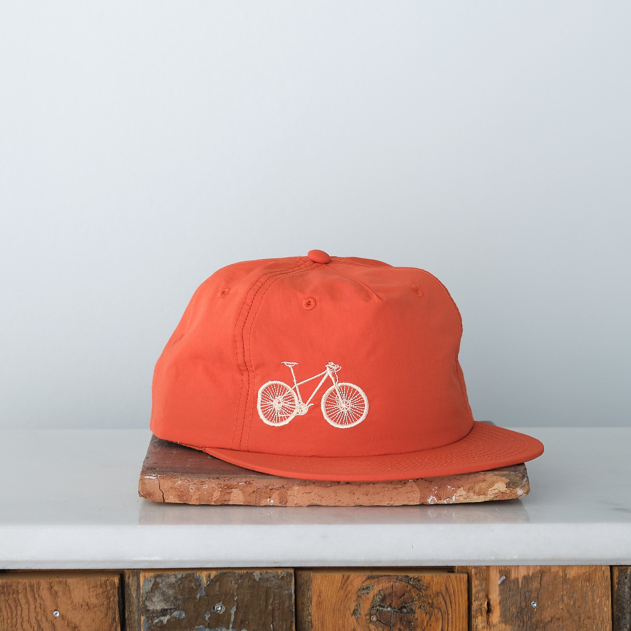 Bicycle Embroidered Nylon Trucker Cap, Persimmon