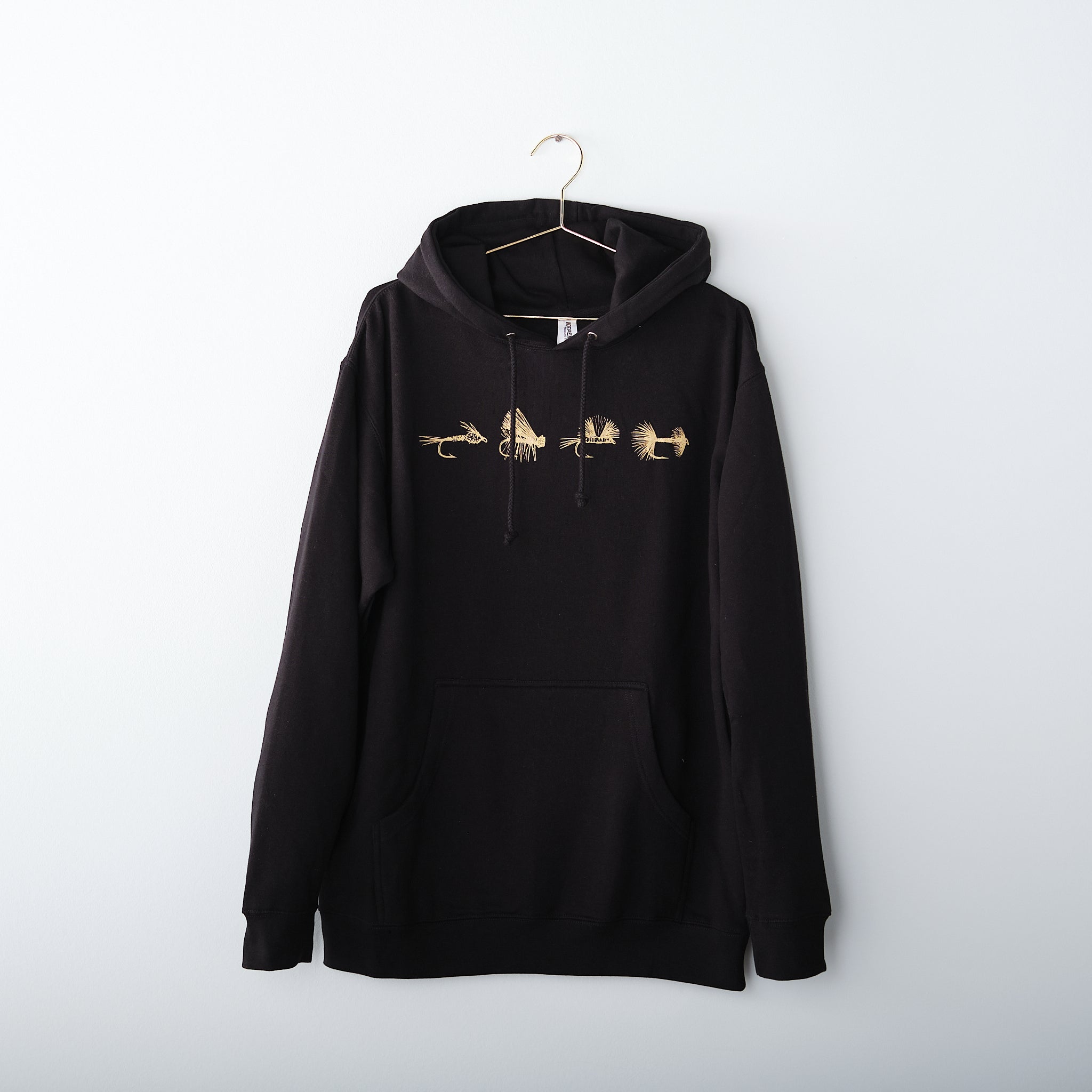 black hoodie with gold fishing flies wooly bugger on wire hanger
