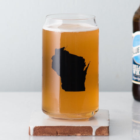 Wisconsin beer can glass sitting next to a Blue Moon bottle