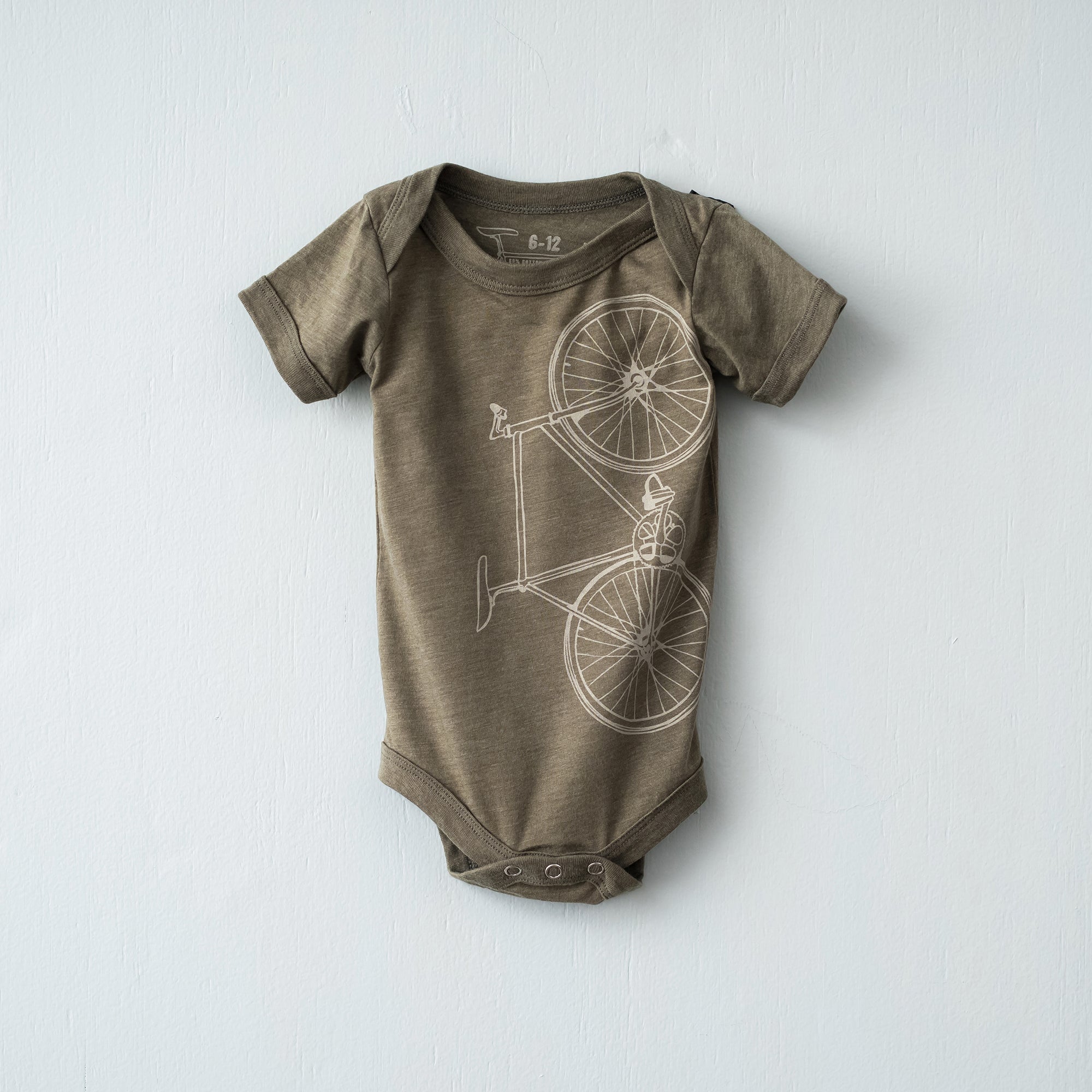 Olive infant one piece screen printed with a cream fixie bicycle